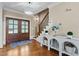 Inviting foyer featuring hardwood floors, a staircase, and decorative accents with great lighting at 55 Fleming Forest Dr, Youngsville, NC 27596
