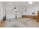 Spacious two-car garage interior with brick detail and ample room for vehicles and storage at 55 Fleming Forest Dr, Youngsville, NC 27596