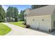 Attached two-car garage offering convenience and ample parking space in a well-maintained home at 55 Fleming Forest Dr, Youngsville, NC 27596