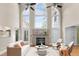 Bright living room with cathedral ceilings, a stone fireplace, and large windows offering ample light at 55 Fleming Forest Dr, Youngsville, NC 27596