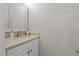 Stylish powder room features a vanity with granite countertop and decorative mirror, creating a neat space at 55 Fleming Forest Dr, Youngsville, NC 27596
