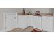 Wet bar featuring granite countertop, mini-fridge, and cabinets for storage at 55 Fleming Forest Dr, Youngsville, NC 27596