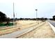 Community ball field with fencing and lights, ideal for sports and recreation at 55 Shoreline Dr, Lillington, NC 27546