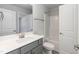 Modern bathroom with a gray vanity, white countertops, ample storage, and a convenient shower-tub combination at 55 Shoreline Dr, Lillington, NC 27546