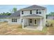 A modern two-story home with a covered patio in backyard shows a well-maintained property at 55 Shoreline Dr, Lillington, NC 27546