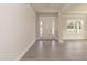 Bright foyer featuring a white front door with sidelights and a window with blinds at 55 Shoreline Dr, Lillington, NC 27546