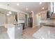 New kitchen with gray cabinets, stainless steel appliances, and a granite island with sink at 55 Shoreline Dr, Lillington, NC 27546