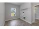 Bright laundry room featuring durable vinyl flooring, convenient utility connections, and a practical wire shelving unit at 55 Shoreline Dr, Lillington, NC 27546
