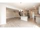 Spacious living room and kitchen featuring an open floor plan and modern gray cabinets at 55 Shoreline Dr, Lillington, NC 27546