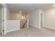 Cozy loft space with plush carpeting, neutral walls, and easy access to upstairs rooms, offering a versatile living area at 55 Shoreline Dr, Lillington, NC 27546