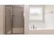 The main bath offers a large soaking tub, a standing shower, and neutral paint at 55 Shoreline Dr, Lillington, NC 27546
