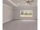 Large main bedroom with a ceiling fan and carpet flooring at 55 Shoreline Dr, Lillington, NC 27546