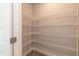 Walk-in pantry with metal shelving, providing ample storage space at 55 Shoreline Dr, Lillington, NC 27546