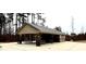 Community picnic shelter with picnic tables and trash cans, great for gatherings and enjoying the outdoors at 55 Shoreline Dr, Lillington, NC 27546
