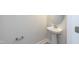 Stylish powder room with pedestal sink, and neutral paint at 55 Shoreline Dr, Lillington, NC 27546
