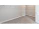 Empty walk-in closet with carpet and metal shelving at 55 Shoreline Dr, Lillington, NC 27546