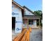 New construction features building wrap with visible door and framework, primed for personalization at 701 East St, Smithfield, NC 27577