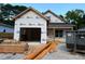 New home under construction with building wrap and materials on site; ready for customization at 701 East St, Smithfield, NC 27577