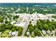 This aerial view shows the town with businesses, greenery, and a train at 701 Holloway St, Durham, NC 27701