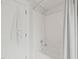 Bright bathroom showcasing a white tiled shower and tub, perfect for a refreshing experience at 701 Holloway St, Durham, NC 27701