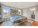 Spacious bedroom with windows offering great natural light and connecting door to ensuite bathroom at 701 Holloway St, Durham, NC 27701