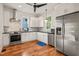 Well-equipped kitchen featuring stainless appliances, white cabinets, and a functional layout at 701 Holloway St, Durham, NC 27701