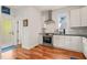 Modern kitchen boasts stainless steel appliances, marble backsplash, and sleek countertops at 701 Holloway St, Durham, NC 27701