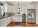 Bright kitchen showcases stainless steel appliances, ample cabinet space, and modern finishes at 701 Holloway St, Durham, NC 27701