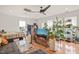 Inviting living room featuring hardwood floors, a comfortable seating area, and ample natural light at 701 Holloway St, Durham, NC 27701