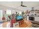 Open concept living space with hardwood floors, stainless steel appliances, and an abundance of natural light at 701 Holloway St, Durham, NC 27701