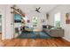 Bright living room with hardwood floors, stylish decor, and comfortable seating with natural light at 701 Holloway St, Durham, NC 27701
