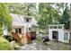 Aerial view of rear exterior with spacious yard and outbuilding at 711 W Carver St, Durham, NC 27704