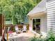 Inviting back deck with two chairs and sliding door access to home at 711 W Carver St, Durham, NC 27704