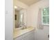 Bathroom featuring a large mirror, sink and natural lighting at 711 W Carver St, Durham, NC 27704