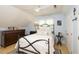Cozy bedroom with soft blue walls, ceiling fan, and decorative details at 711 W Carver St, Durham, NC 27704