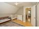 Bright bedroom featuring a crib, a changing table, and natural light at 711 W Carver St, Durham, NC 27704