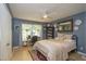 Comfortable bedroom with natural light, a ceiling fan, and ample space for relaxation at 711 W Carver St, Durham, NC 27704