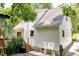 Exterior side view showcasing house siding and landscaping at 711 W Carver St, Durham, NC 27704