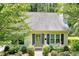 Charming front yard with well-manicured garden and bushes at 711 W Carver St, Durham, NC 27704