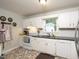 Functional kitchen featuring white cabinets, modern appliances, and stylish flooring at 711 W Carver St, Durham, NC 27704