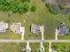 Bird's-eye view showcases neighborhood homes on expansive lots, with one backing to a lovely pond at 7217 Leando Dr, Willow Springs, NC 27592