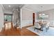 Dining room with hardwood flooring, chair rail, and a modern chandelier above a dining table at 7217 Leando Dr, Willow Springs, NC 27592