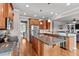 Modern kitchen with granite countertops, stainless steel appliances, central island and hardwood floors at 7217 Leando Dr, Willow Springs, NC 27592