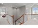 Landing with staircase leading to different rooms and featuring neutral carpet and grey paint at 7217 Leando Dr, Willow Springs, NC 27592