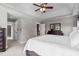Main bedroom boasting a tray ceiling, carpet floors, dresser, mirror, and ample natural light at 7217 Leando Dr, Willow Springs, NC 27592