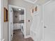 Mud room with built-in storage and laundry room featuring white cabinets and tile floors at 7217 Leando Dr, Willow Springs, NC 27592