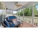 Relaxing screened-in porch features comfortable seating and a view of the lush backyard at 7217 Leando Dr, Willow Springs, NC 27592