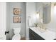Stylish half bathroom with modern fixtures, sink and mirror at 7529 Tynewind Dr, Wake Forest, NC 27587