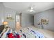 Bedroom featuring blue accents, neutral carpet, and a ceiling fan at 7529 Tynewind Dr, Wake Forest, NC 27587