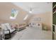 Bedroom room featuring a crib, daybed, rocking chair, carpet, and skylights at 7529 Tynewind Dr, Wake Forest, NC 27587